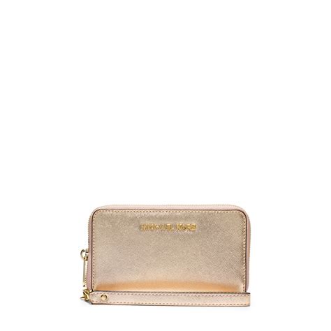 michael kors jet set travel envelope clutch old gold|Jet Set Travel Large Logo Debossed Envelope Wallet .